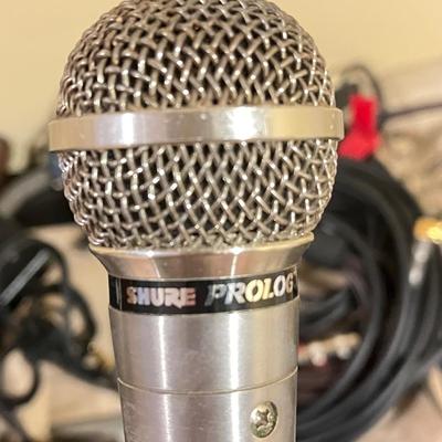 LOT 105B: Big Music Lot - Guitar Case, Sheet Music Stand and Books, Instrument and Mic Stands and More