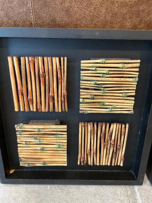 Two bamboo wall art pieces
