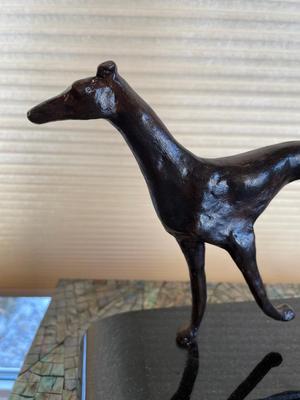 Greyhound statue on marble base by Cynthia Markle