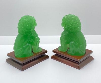 Lot 510: Beautiful Green Glass Foo Dog Sculptures on Wooden Stands
