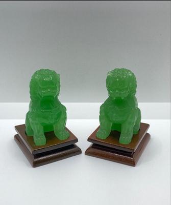 Lot 510: Beautiful Green Glass Foo Dog Sculptures on Wooden Stands
