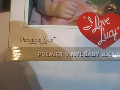 Premier Vinyl Baby Lucy Doll Collection