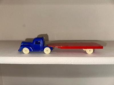 1937 AUBURN RUBBER CABOVER STAKE TRUCK & PLASTIC TRUCK W/TRAILER