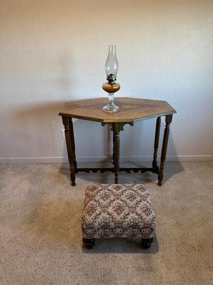 ANTIQUE SIDE TABLE, OIL LAMP AND UPHOLSTERED OTTOMAN