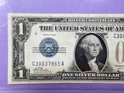 SERIES OF 1928 CRISP AU/UNCIRCULATED "FUNNY BACK" SILVER CERTIFICATE AS PICTURED.