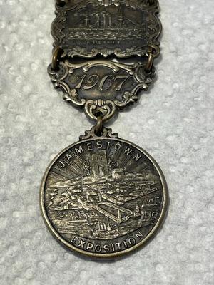 ANTIQUE 1607/1907 JAMESTOWN TER-CENTENNIAL EXPOSITION SILVER WATCH FOB IN GOOD PREOWNED CONDITION. FREE DOMESTIC SHIPPING.