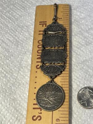ANTIQUE 1607/1907 JAMESTOWN TER-CENTENNIAL EXPOSITION SILVER WATCH FOB IN GOOD PREOWNED CONDITION. FREE DOMESTIC SHIPPING.