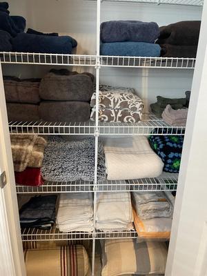 Linen closet full of Towles, blankets, misc linens