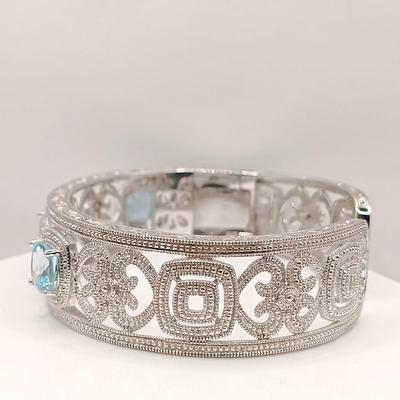 LOT 10: ISP 925 Sterling China Hinged Cuff with Blue Topaz Stones 39.4gtw