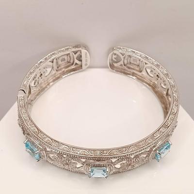 LOT 10: ISP 925 Sterling China Hinged Cuff with Blue Topaz Stones 39.4gtw