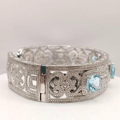 LOT 10: ISP 925 Sterling China Hinged Cuff with Blue Topaz Stones 39.4gtw