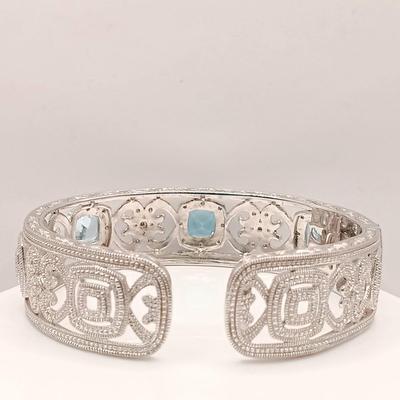 LOT 10: ISP 925 Sterling China Hinged Cuff with Blue Topaz Stones 39.4gtw