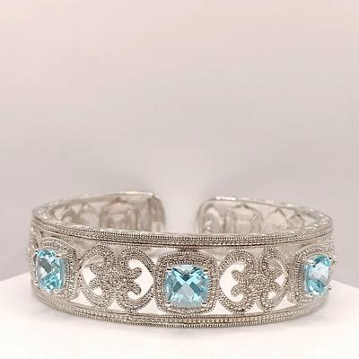 LOT 10: ISP 925 Sterling China Hinged Cuff with Blue Topaz Stones 39.4gtw