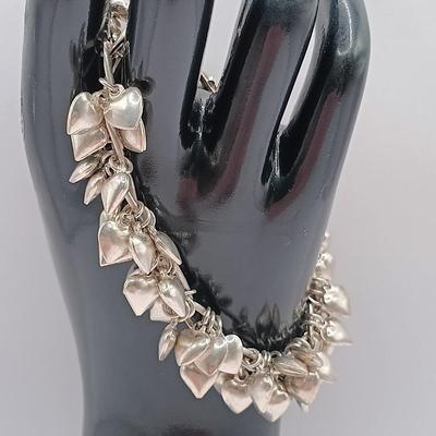 LOT 142: Sterling 925 Heart Charm Bracelet 46.04g