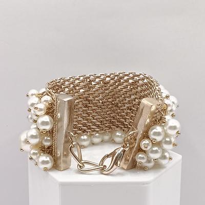 LOT 144: Feaux Pearl Bracelet with a Collection of Costume Earrings