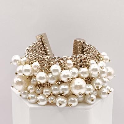 LOT 144: Feaux Pearl Bracelet with a Collection of Costume Earrings