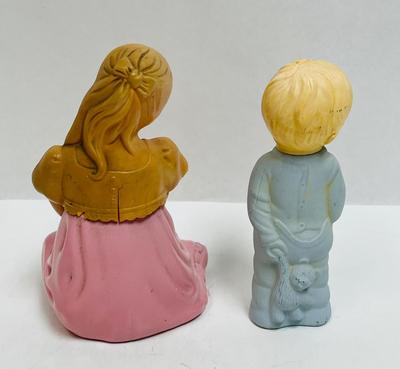 Boy and girl figuring perfume bottles,Avon