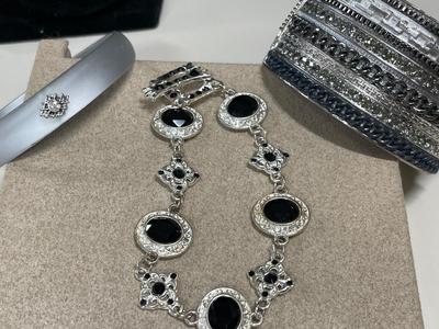 Black and silver tone rings, necklace and bracelets