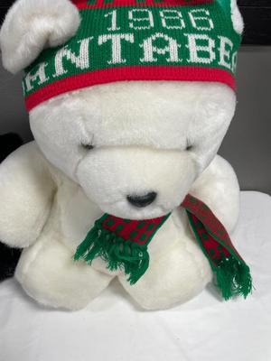 Stuffed animals in Santa bear