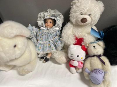 Stuffed animals in Santa bear