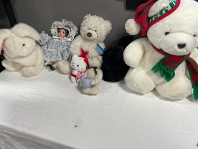Stuffed animals in Santa bear
