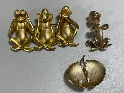 Signed gold tone brooches