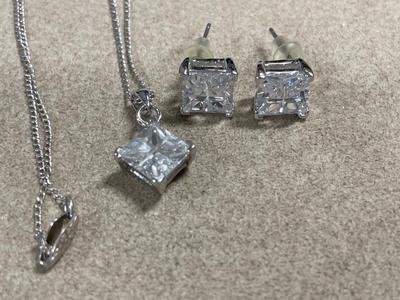 Sterling necklace with sparkling pendant and matching earrings