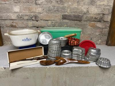 Sale Photo Thumbnail #105: Vintage Corelle casserole, vintage Tupperware celery keeper, tons of mini molds, wooden salad utensils set, cake spreader, and a NIB set of steak knives