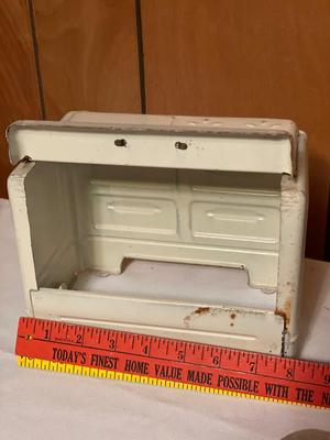 Tin toy stove with children’s baking toys