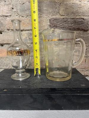 Sale Photo Thumbnail #127: Scalloped glass serving bowl, Anchor Hocking basket weave vase, Bartlett and Collins “Golden Grape” pitcher with wear and chips at spout, vintage genie bottle decanter w/o stopper, , Anchor Hocking candy dish, and teeny tiny ampule