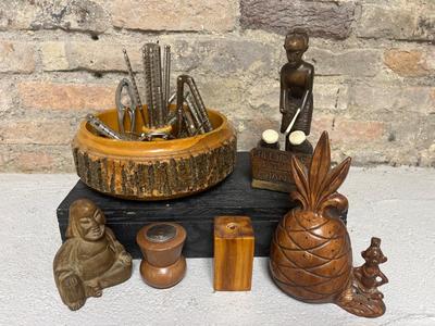 Sale Photo Thumbnail #159: Vintage nut tray with multiple nut crackers and nut meat picks, Ghana figure, small statuette of The Buddha, Hawaiian pineapple toothpick holder (ceramic), one single wooden salt/pepper shaker, wood block candle holder

Kaaren knocked it outta the park wi