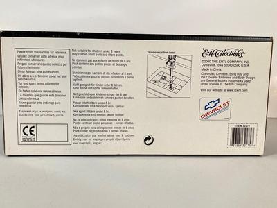 LOT 57: Chevy Corvette Collection - Large Photograph, Tin Signs, 1967 Ertl Collectible American Muscle Sting Ray Diecast, Chronical Book...