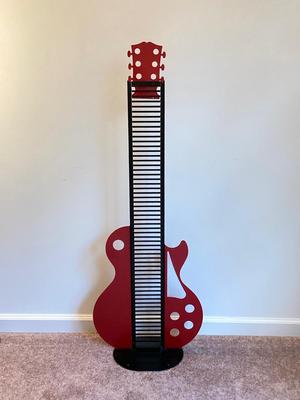 LOT 58: Guitar CD Holder / Stand, Vintage Fife Instrument with Books, Plastic Voilin Storage Box, Violin Shaped Wood Wall Display and Two...