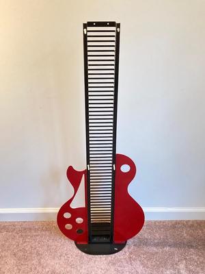 LOT 58: Guitar CD Holder / Stand, Vintage Fife Instrument with Books, Plastic Voilin Storage Box, Violin Shaped Wood Wall Display and Two...