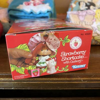 LOT 88: Vintage Strawberry Shortcake Doll, Popples Fuzzy Pillow Cover, Strawberry Shortcake Ornament, Strawberry Shortcake Music Box,...