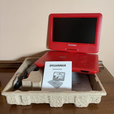 LOT 104: Transistor Radios, Sylvania Portable DVD Player, Olympus Pearlcorder, Am/Fm Cordless Portable Alarm Clock Radio