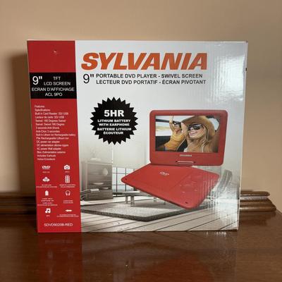 LOT 104: Transistor Radios, Sylvania Portable DVD Player, Olympus Pearlcorder, Am/Fm Cordless Portable Alarm Clock Radio