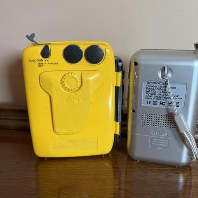 LOT 104: Transistor Radios, Sylvania Portable DVD Player, Olympus Pearlcorder, Am/Fm Cordless Portable Alarm Clock Radio