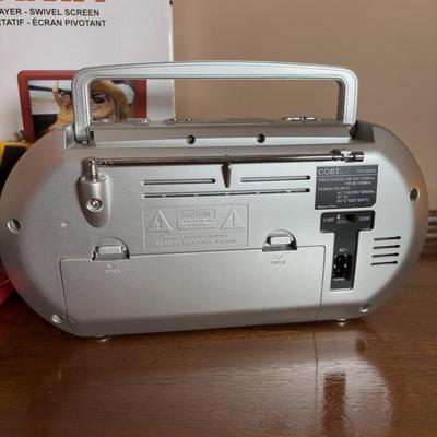 LOT 104: Transistor Radios, Sylvania Portable DVD Player, Olympus Pearlcorder, Am/Fm Cordless Portable Alarm Clock Radio