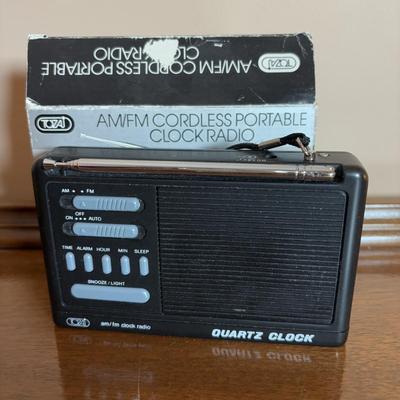 LOT 104: Transistor Radios, Sylvania Portable DVD Player, Olympus Pearlcorder, Am/Fm Cordless Portable Alarm Clock Radio