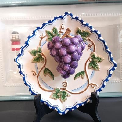 LOT 192: Bella Casa by Ganz Fruit Art Plates, Berkley Jenson Serving Platter, Coyne's Co. Picnic Basket Cheese Knife Set & More