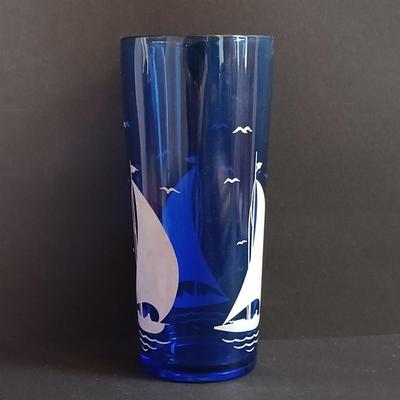 LOT 195: Vintage Cobalt Blue Sailboat Glass, S.S. Oceanic Coaster Set, Global Miniatures Artist Signed Prints & More