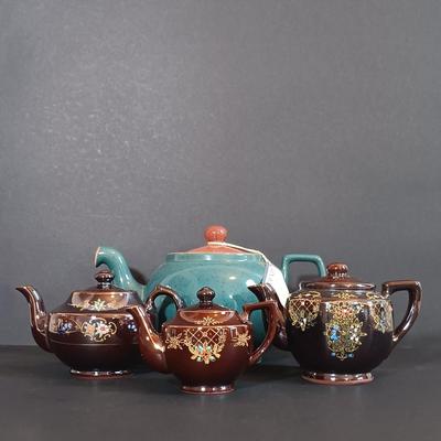 LOT 197: Denby 'Nevva Drip' Teapot with Set of (3) Redware Teapots