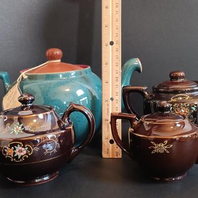 LOT 197: Denby 'Nevva Drip' Teapot with Set of (3) Redware Teapots