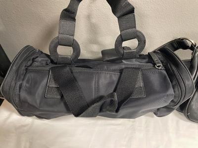 2 black purses with tags