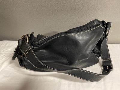 2 black purses with tags