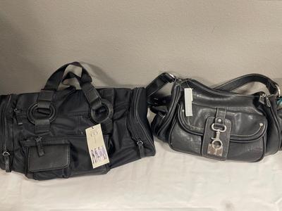2 black purses with tags