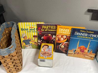 Basket with vintage cookbooks and tin