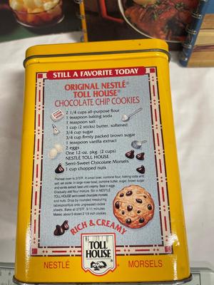 Basket with vintage cookbooks and tin