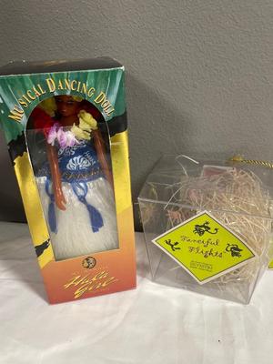 Musical hula doll and fanciful flights